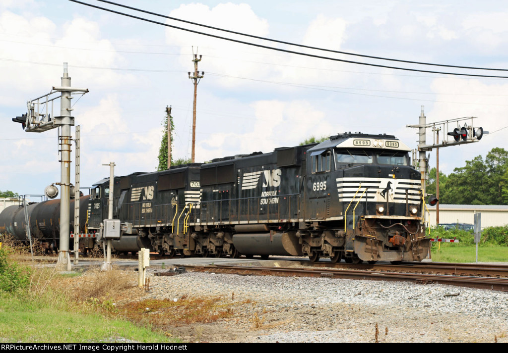 NS 6995 leads train P61 past the old yard